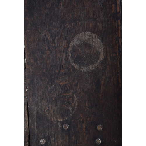 261 - A George III 18th century oak coffer blanket box. The chest having a hinged top with studded joints ... 