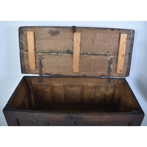 261 - A George III 18th century oak coffer blanket box. The chest having a hinged top with studded joints ... 