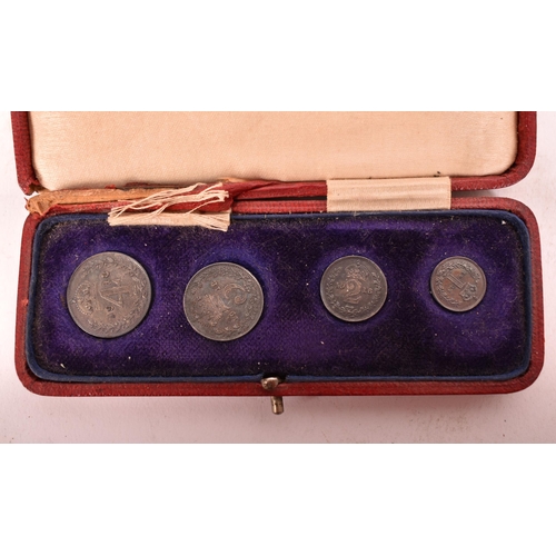 264 - A cased  maundy Money 1918 set. The four piece George V set, with original fitted case of red leathe... 