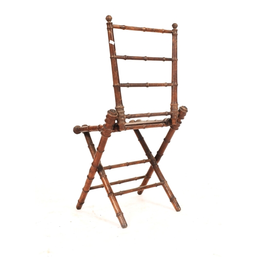 272 - A French inspired early 20th century faux bamboo wooden folding child's chair. The chair having a la... 