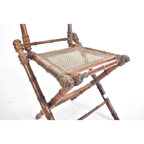 272 - A French inspired early 20th century faux bamboo wooden folding child's chair. The chair having a la... 