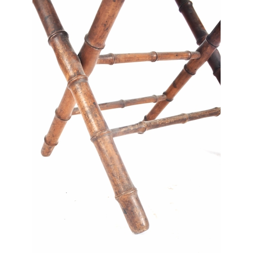 272 - A French inspired early 20th century faux bamboo wooden folding child's chair. The chair having a la... 