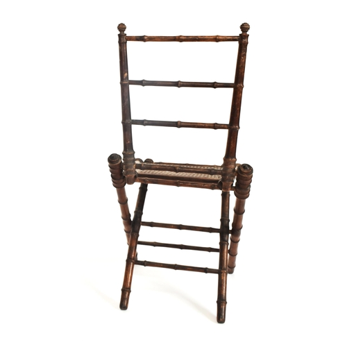 272 - A French inspired early 20th century faux bamboo wooden folding child's chair. The chair having a la... 