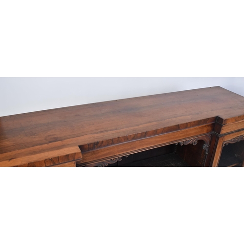 275 - A 19th century mahogany breakfront sideboard credenza. The sideboard having a straight top over a ce... 