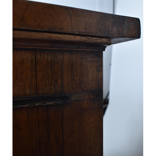 275 - A 19th century mahogany breakfront sideboard credenza. The sideboard having a straight top over a ce... 