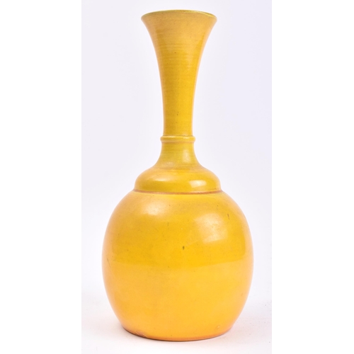 279 - An early 20th century Chinese Oriental believed Qing Dynasty ceramic yellow glaze bottle vase. The v... 