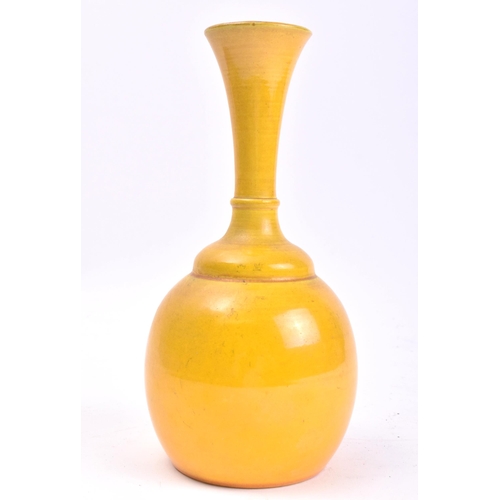 279 - An early 20th century Chinese Oriental believed Qing Dynasty ceramic yellow glaze bottle vase. The v... 