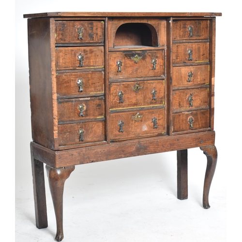 280 - A Queen Anne 18th century walnut chest on stand. The chest having a straight top over a central pige... 