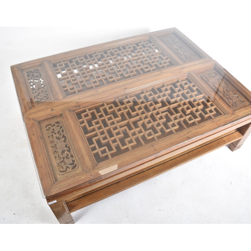 283 - A 20th century Chinese Oriental carved hardwood glazed top opium style occasional low coffee table. ... 