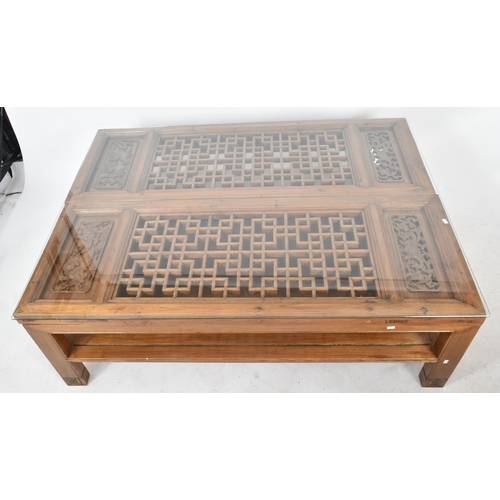 283 - A 20th century Chinese Oriental carved hardwood glazed top opium style occasional low coffee table. ... 