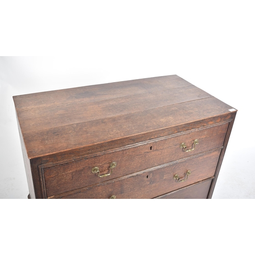 290 - A George III early 19th century circa 1800 oak chest of drawers. The chest having a straight top ove... 