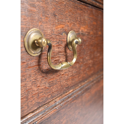 290 - A George III early 19th century circa 1800 oak chest of drawers. The chest having a straight top ove... 