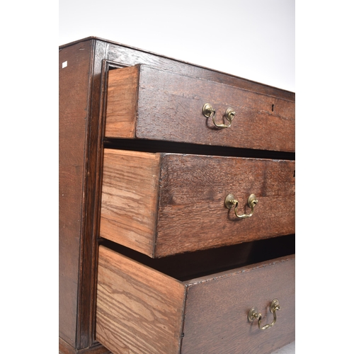 290 - A George III early 19th century circa 1800 oak chest of drawers. The chest having a straight top ove... 