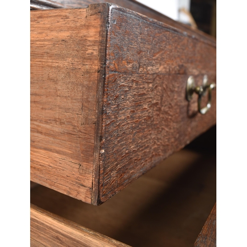 290 - A George III early 19th century circa 1800 oak chest of drawers. The chest having a straight top ove... 