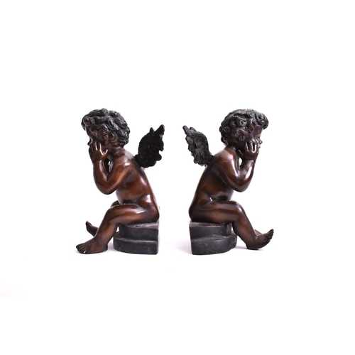 293 - A pair of early 20th century bronze cherub sculptures. Each of the cherubs seated on plinth base, wi... 