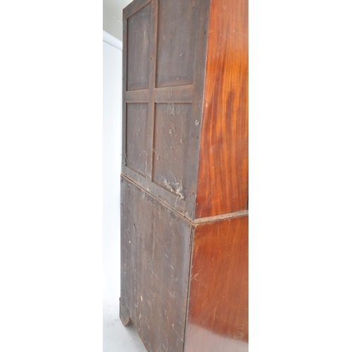 294 - A 19th century George III mahogany estate bookcase bureau. The bureau with twin fielded panel doors ... 