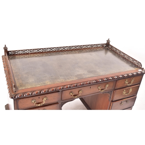 300 - A 19th century Chippendale influenced mahogany office writing table desk. The desk having a pierced ... 