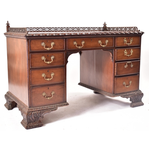 300 - A 19th century Chippendale influenced mahogany office writing table desk. The desk having a pierced ... 