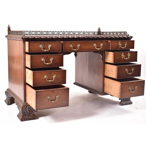 300 - A 19th century Chippendale influenced mahogany office writing table desk. The desk having a pierced ... 