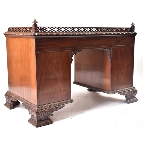 300 - A 19th century Chippendale influenced mahogany office writing table desk. The desk having a pierced ... 