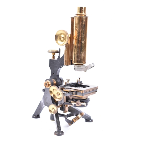 306 - W. Watson & Sons Ltd - An early 20th century brass & metal ' Royal ' microscope. The microscope with... 