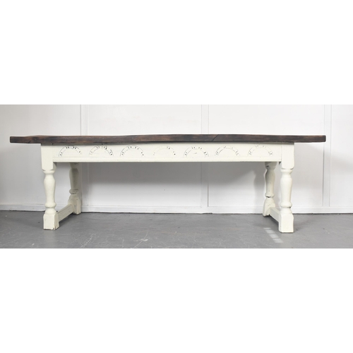 307 - A 19th century French continental elm wood refectory farmhouse dining table. The table having a sing... 