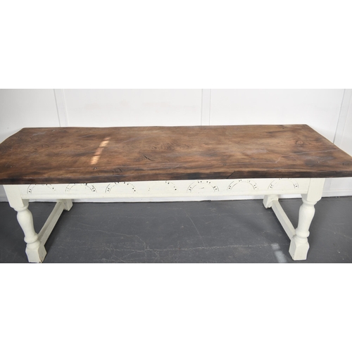 307 - A 19th century French continental elm wood refectory farmhouse dining table. The table having a sing... 