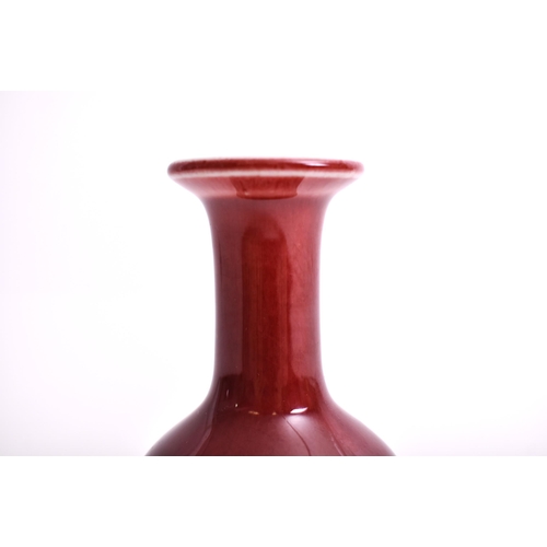 321 - A 19th century Chinese Oriental Qing Dynasty Sang de Boeuf red ox blood glazed ceramic vase. The vas... 