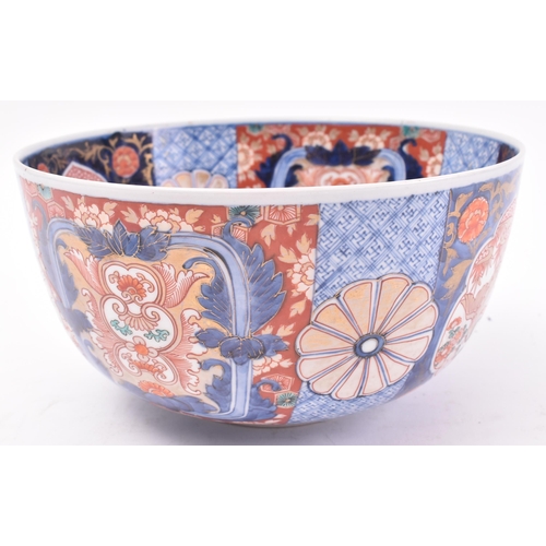 323 - A large early 20th century Meiji Japanese Imari pattern bowl / centrepiece. Hand painted with floral... 