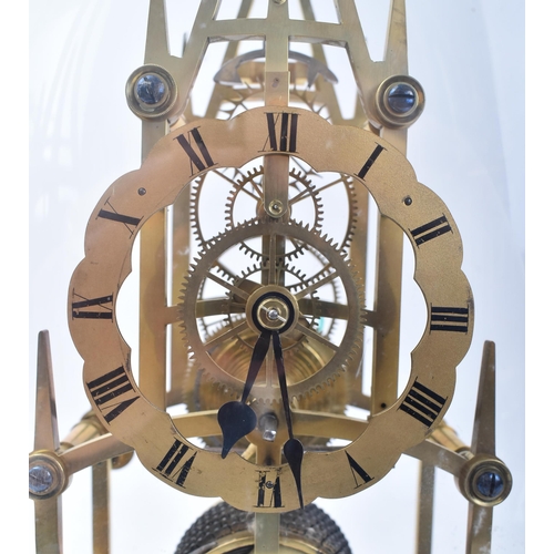 326 - A 19th century Victorian brass skeleton Cathedral clock in dome. The brass fusee movement skeleton c... 