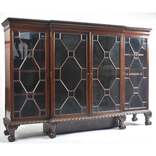 328 - A Victorian 19th century mahogany break front astragal glazed display cabinet. The cabinet having a ... 