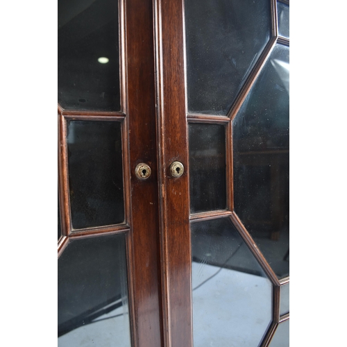 328 - A Victorian 19th century mahogany break front astragal glazed display cabinet. The cabinet having a ... 