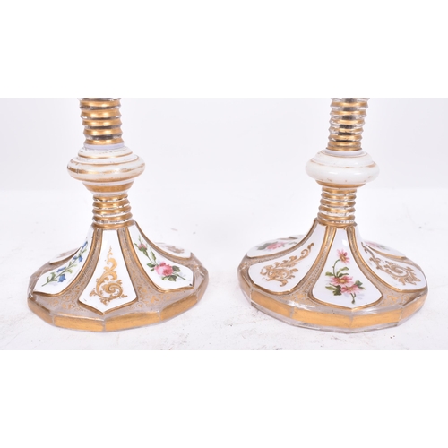 33 - A pair of 19th century Bohemian Czech overlay glass vases. White flash work with chintz foliate disp... 