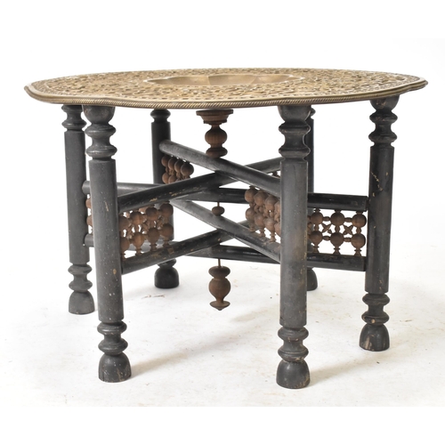 331 - A large early 20th century Indian Benares embossed brass & wooden side coffee table. The table havin... 