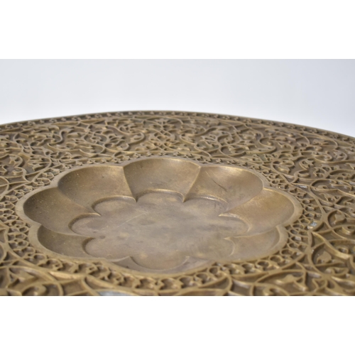 331 - A large early 20th century Indian Benares embossed brass & wooden side coffee table. The table havin... 