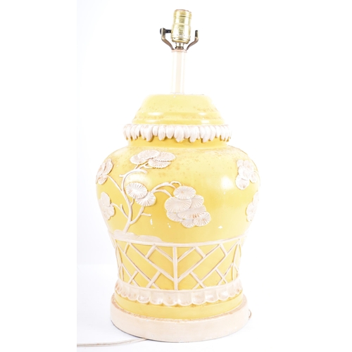 332 - A mid 20th century American Hollywood Regency style Chinese yellow and white lamp. Bulbous form with... 