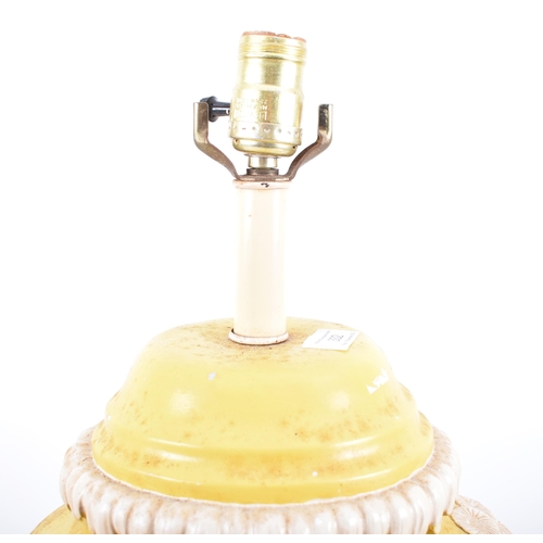 332 - A mid 20th century American Hollywood Regency style Chinese yellow and white lamp. Bulbous form with... 