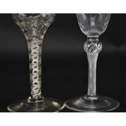 333 - Two 18th century wine glasses, each with a twist stem. One being a mid 18th century circa 1750 glass... 