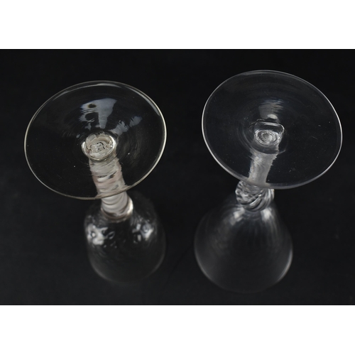 333 - Two 18th century wine glasses, each with a twist stem. One being a mid 18th century circa 1750 glass... 