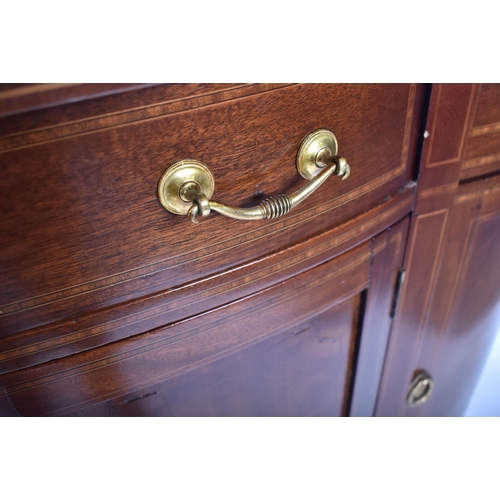 337 - A 19th century Victorian mahogany bow front sideboard / serving board. The server having cross bande... 