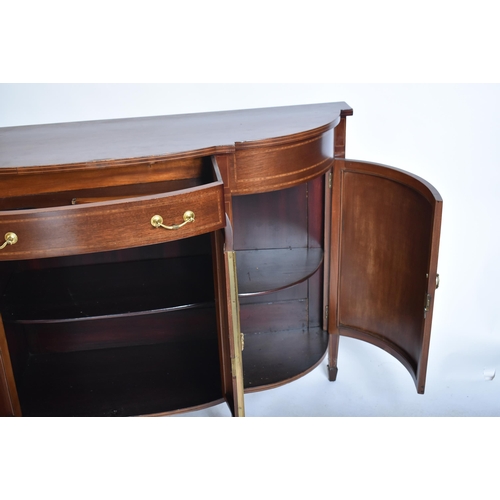 337 - A 19th century Victorian mahogany bow front sideboard / serving board. The server having cross bande... 