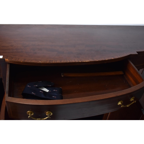 337 - A 19th century Victorian mahogany bow front sideboard / serving board. The server having cross bande... 