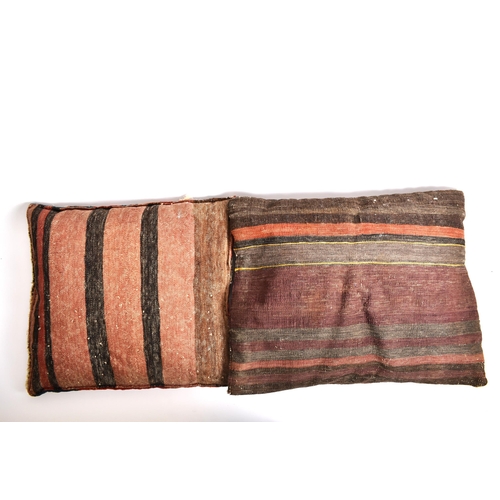 341 - A pair of early 20th century Kilim cushions. The cushion covers having been repurposed into cushions... 