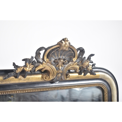 344 - A 19th century French Continental ebonised & silver gilt wood over mantel mirror. The overmantle mir... 