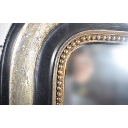 344 - A 19th century French Continental ebonised & silver gilt wood over mantel mirror. The overmantle mir... 