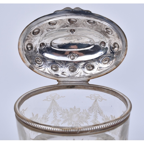 351 - A silver hallmarked and cut glass Bon Bon / biscuit box. Raised on bun feet with banded base, silver... 