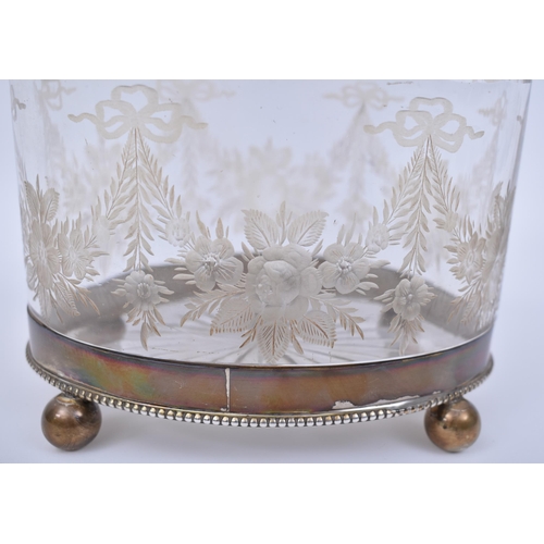 351 - A silver hallmarked and cut glass Bon Bon / biscuit box. Raised on bun feet with banded base, silver... 