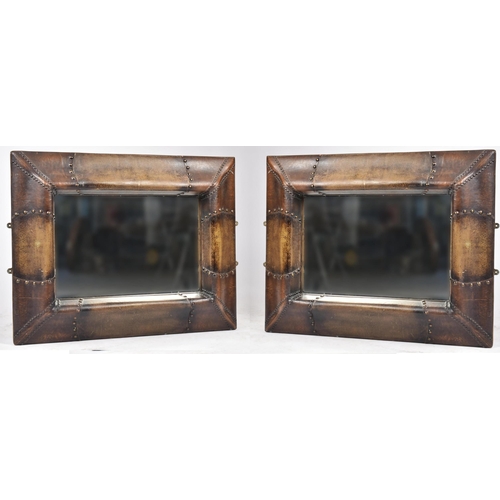 353 - A large pair of contemporary designer leather framed mirrors. Each with cushioned frames and stud de... 