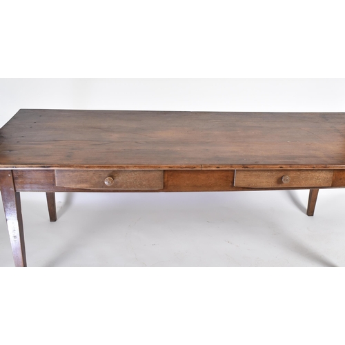 370 - A 19th century French Continental chestnut wood refectory farmhouse dining table. The table having a... 