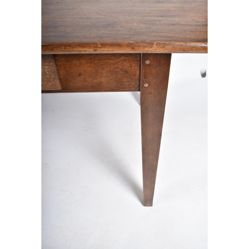 370 - A 19th century French Continental chestnut wood refectory farmhouse dining table. The table having a... 